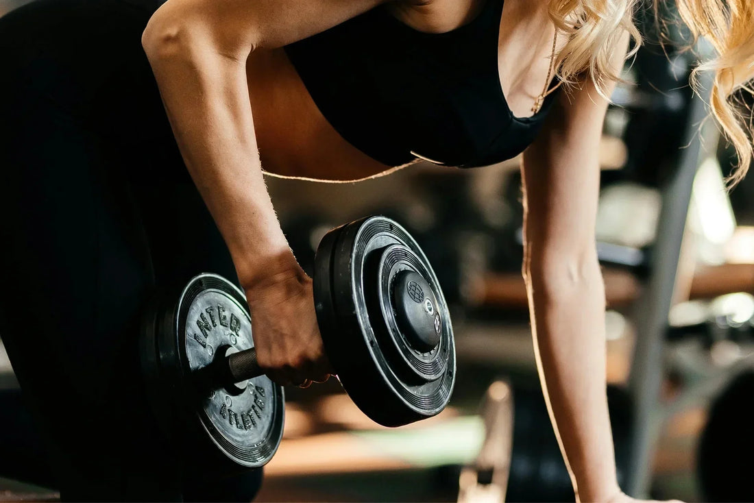 A women strength training with dumbells