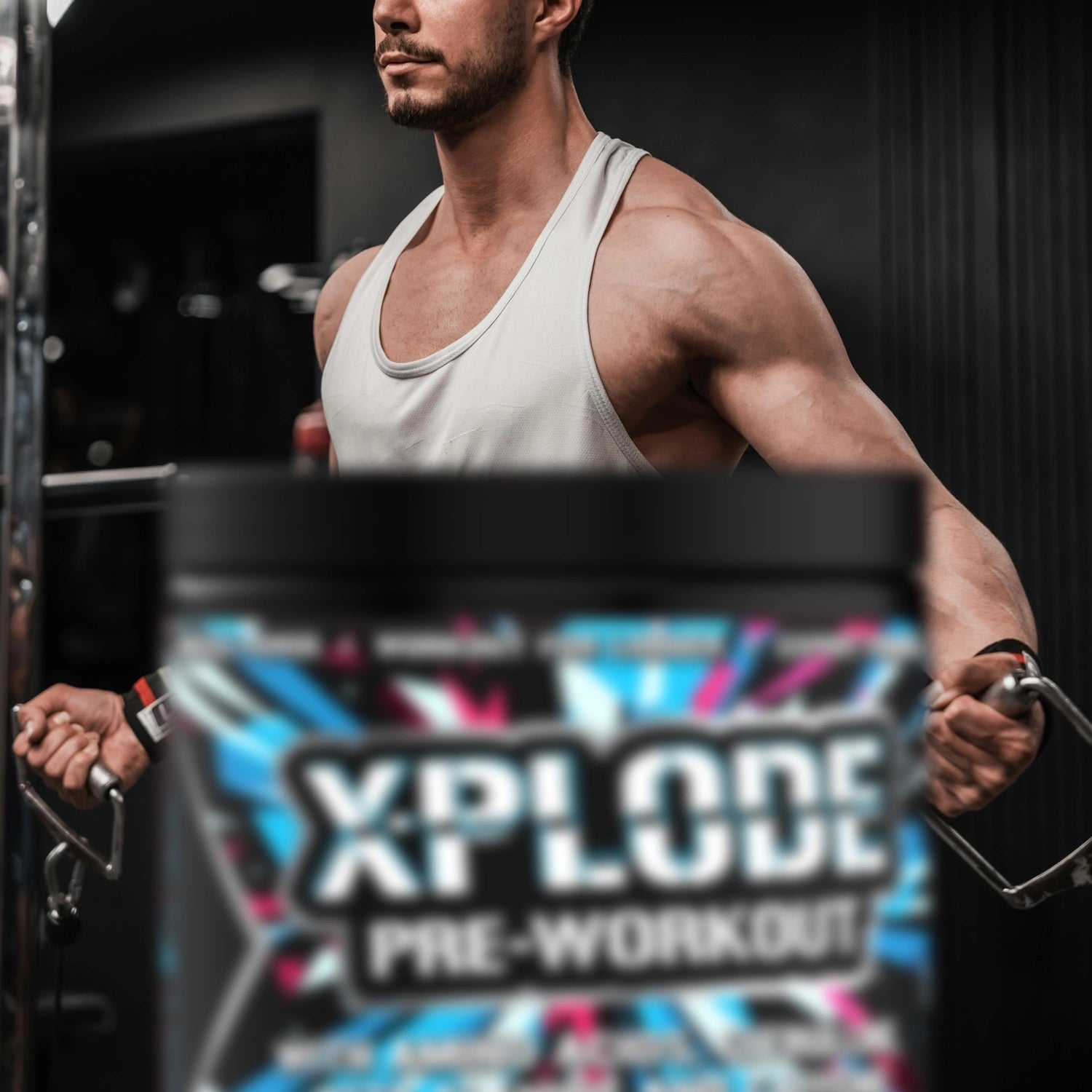 Man lifting weights with a container of Xplode pre-workout supplement in the foreground.