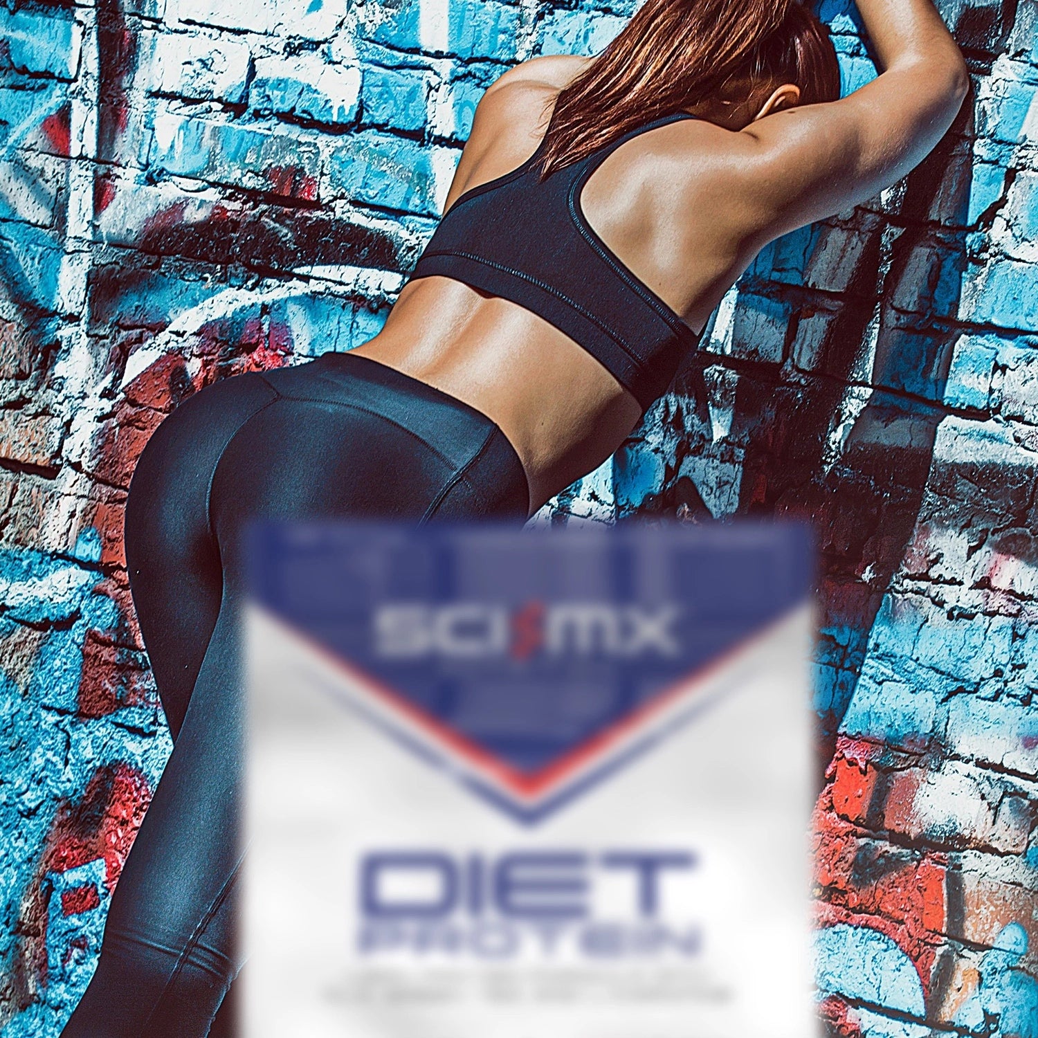 Person in athletic wear leaning against a colourful brick wall with a Sci-Mx Diet Protein product in the foreground.