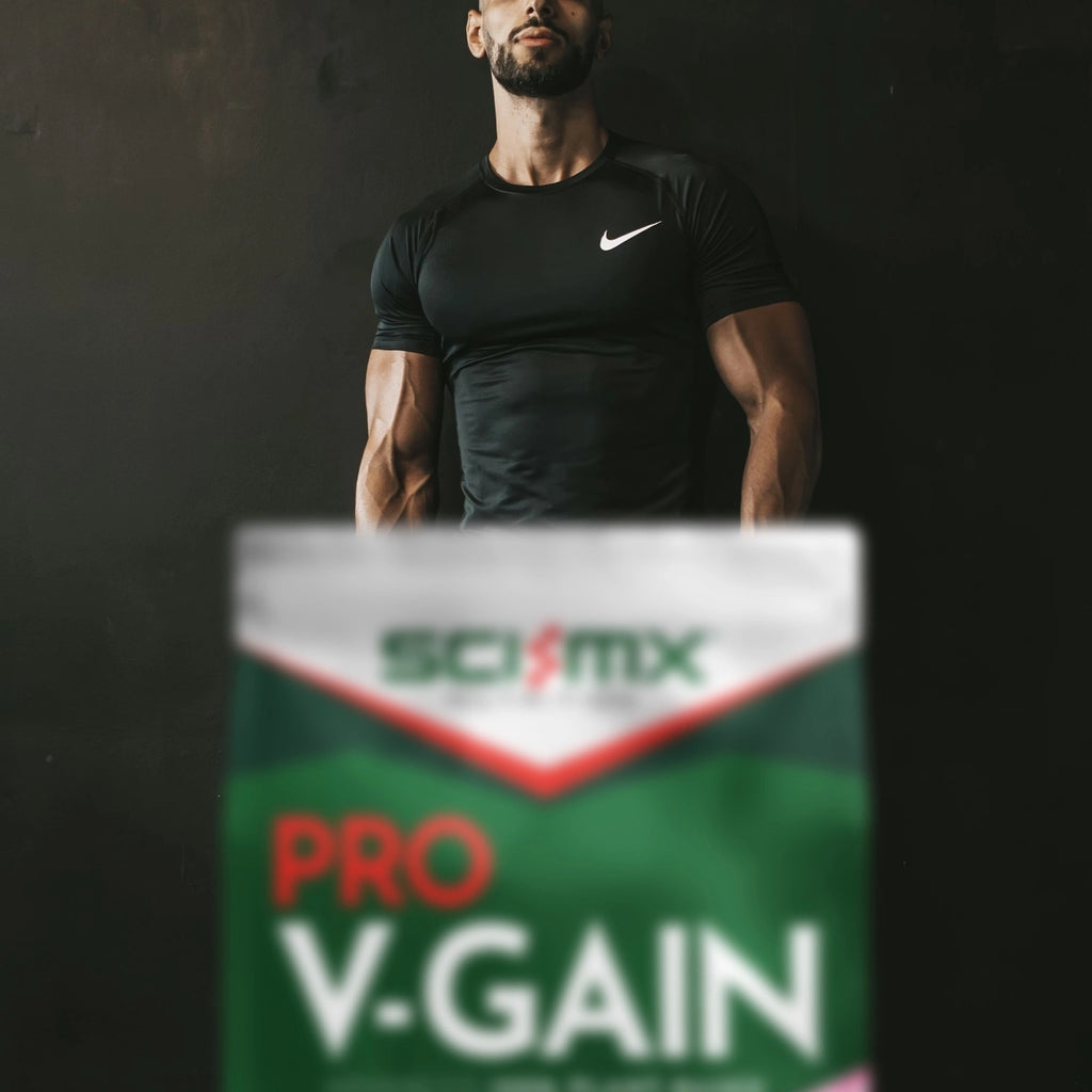 Man in black athletic shirt with Scivation Pro V-Gain supplement box in foreground