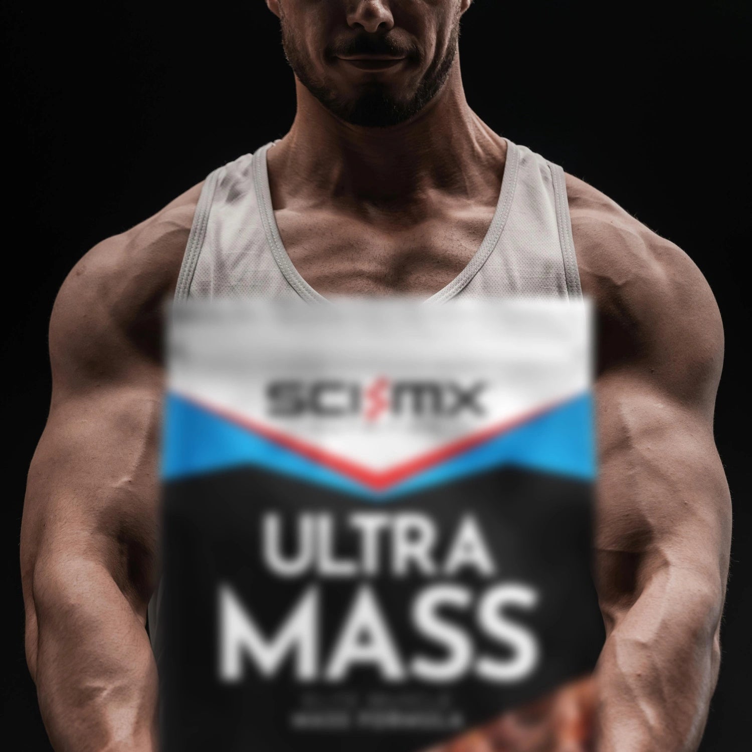 Muscular man with a pack of SCI-MX Ultra Mass Protein Gainer in the foreground