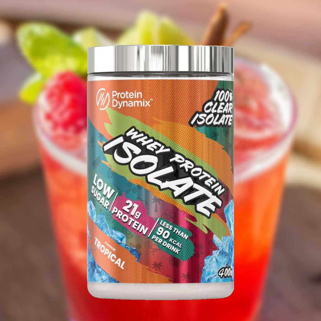 Protein Dynamix whey protein isolate container with a tropical drink in the background