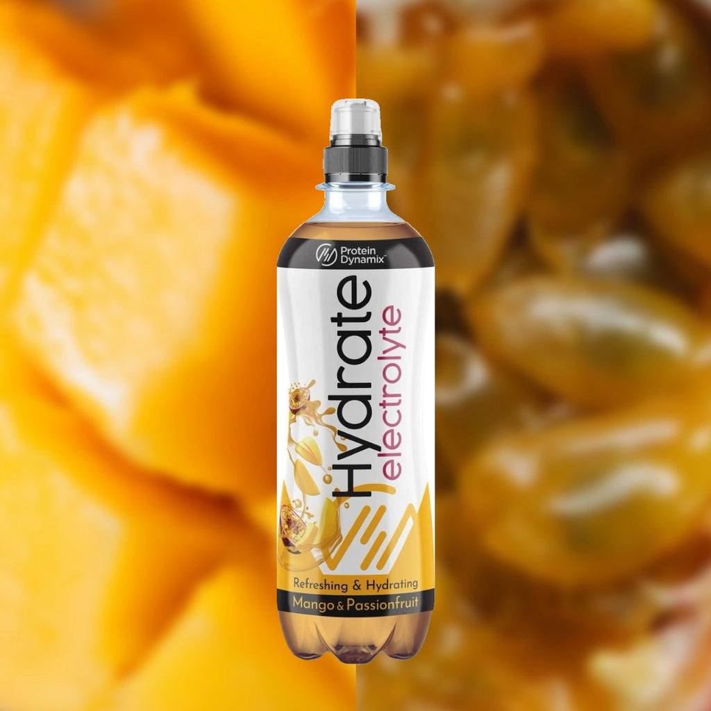 Hydrate electrolyte bottle with mango and passionfruit flavor against a blurred fruit background