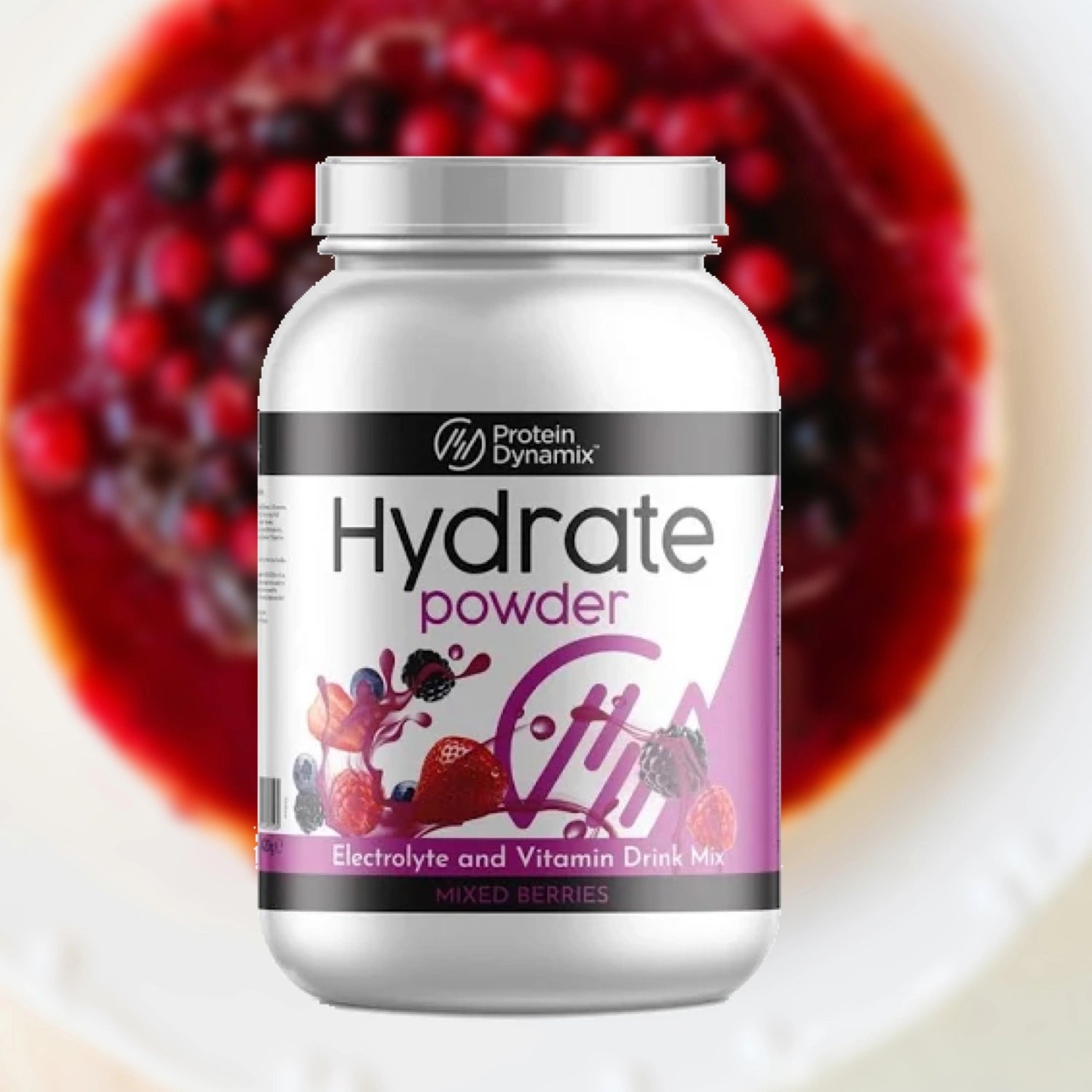 Protein Dynamix Hydrate powder container with mixed berries in the background