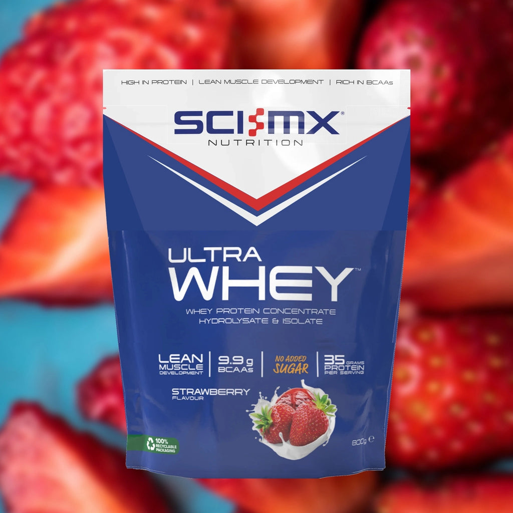 Sci-Mx Nutrition Ultra Whey protein powder package with strawberries in the background