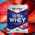 A bag of SCI-MX Nutrition Ultra Whey protein powder in strawberry flavor, shown in front of a blurred background of sliced strawberries.