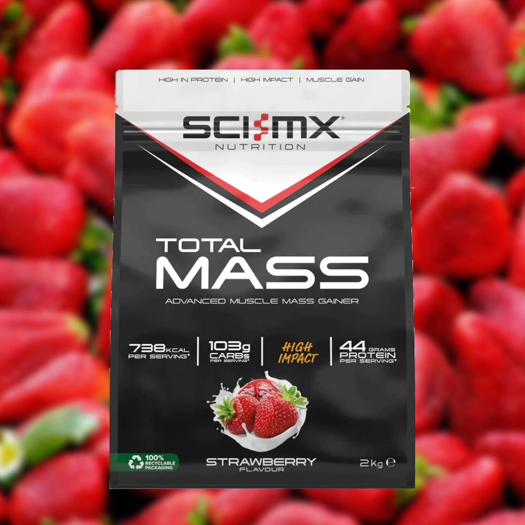 Sci-MX Nutrition Total Mass supplement package with strawberries in the background