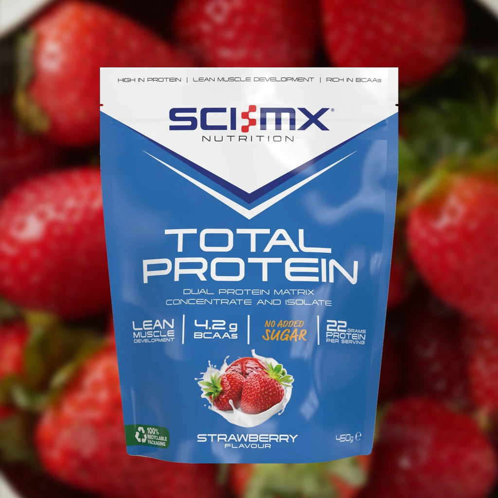 Sci-Mx Nutrition Total Protein package with strawberries in the background