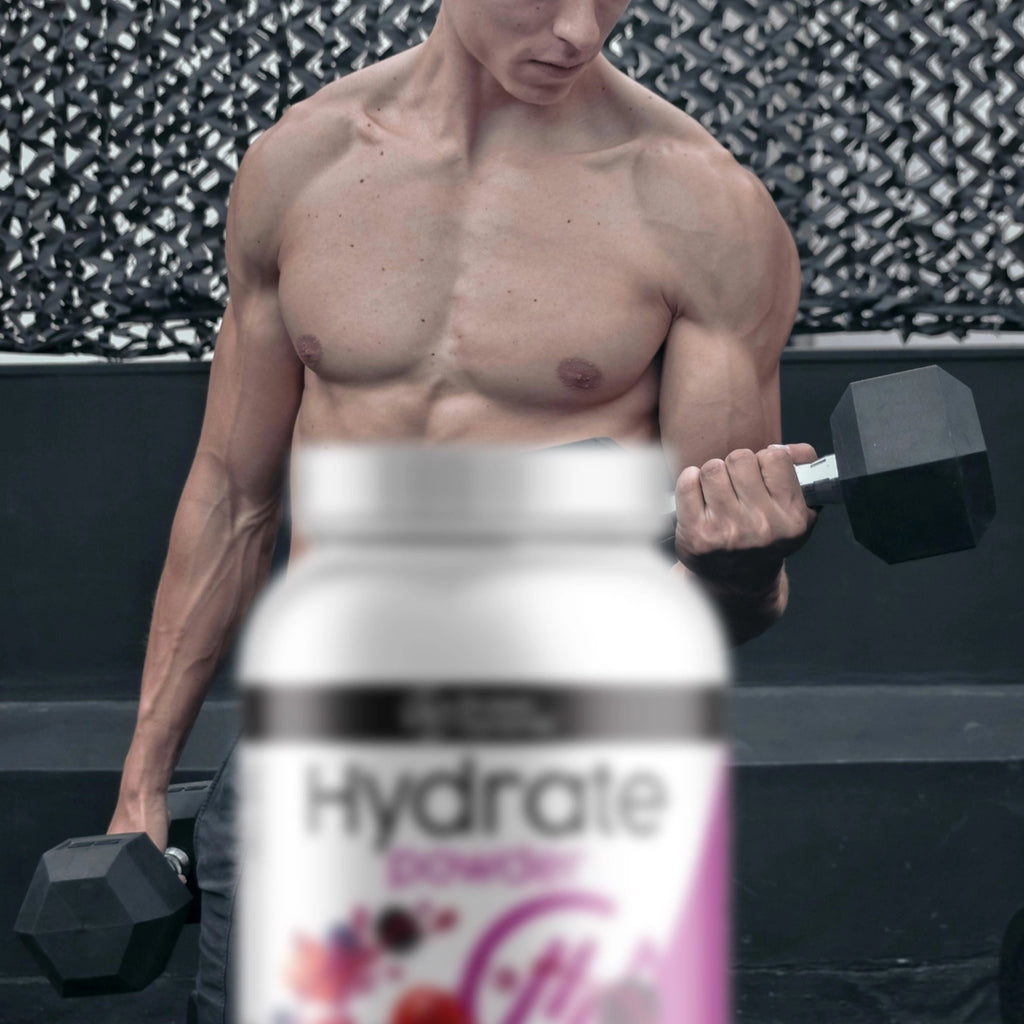 Man lifting weights with a bottle of Hydrate Powder in the foreground
