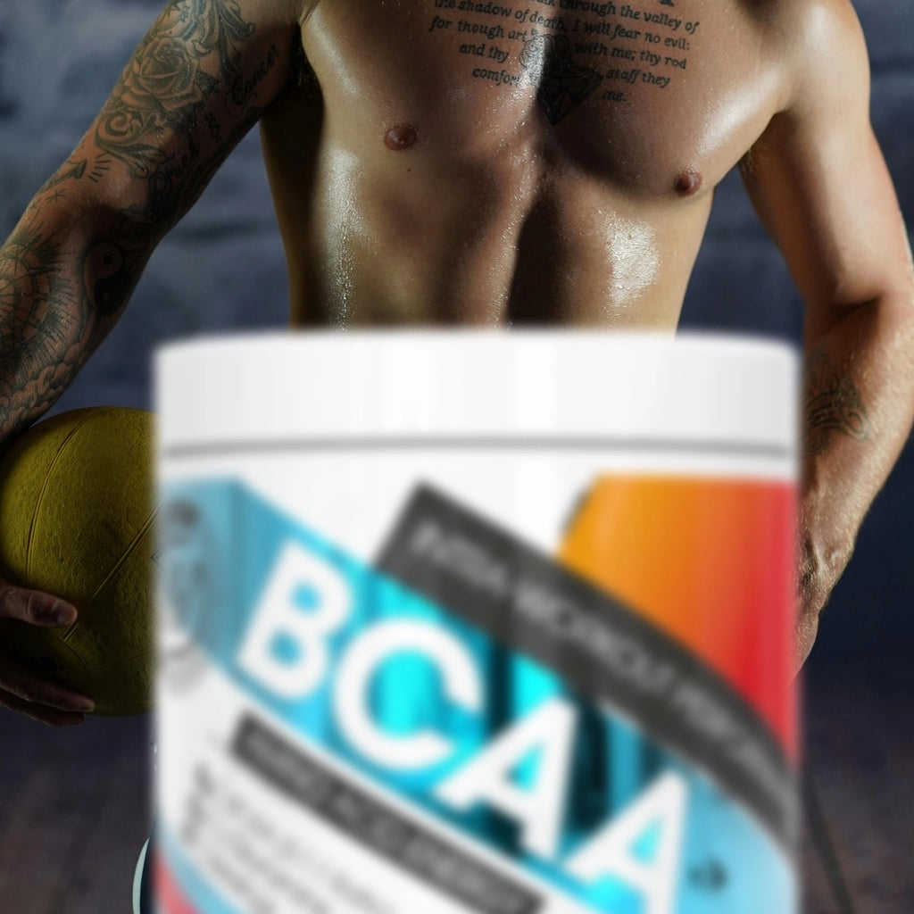 Person holding a container of BCAA supplement with a blurred background