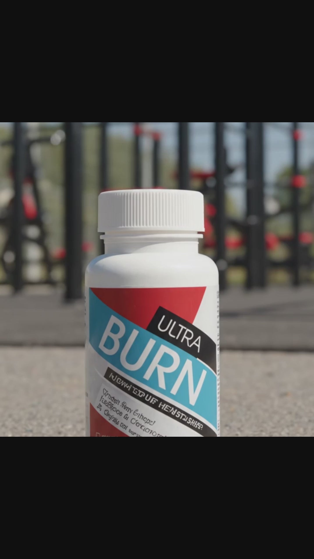 A bottle of Protein Dynamix capsules pops open, as many capsules fly into the air before they burst into flames.