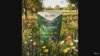 SCI-MX V-GAIN protein powder pack in a meadow of wildflowers and long grasses.